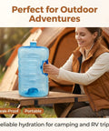 Person holding 5 Gallon Stackable Water Jug With Easy Grip Handle And Screw Cap For Home Office Camping And Emergency Water Storage Large Capacity Hydration For Outdoor Prep at campsite