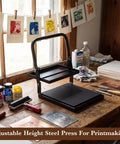 Block Printing Press For Linocut And Hand Letterpress Adjustable Height Steel Press Model B in a home studio setup.