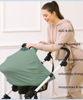 Woman adjusting All In One Baby Car Seat Cover And Canopy With Breathable Buttery Soft Stretch Fabric Nursing Cover Stroller Shield