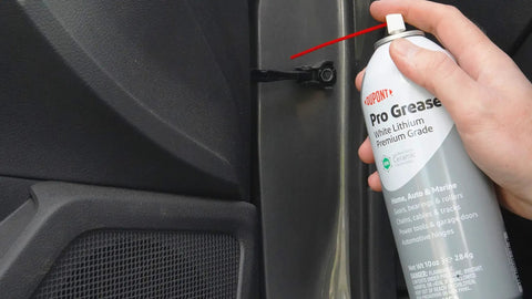 Applying Teflon White Lithium Grease Aerosol Spray 10 Oz For All Weather Lubrication to car door hinge