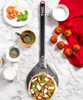 8 Inch Perforated Pizza Peel With Long Handle Aluminum Turning Peel beside pizza ingredients on marble surface