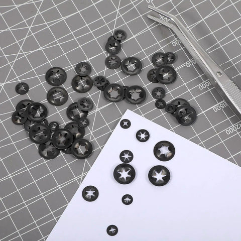 Internal Tooth Star Lock Washers 50 Pcs Set In 5 Sizes With Push On Speed Clips Built To Last Carbon Steel With Black Anodized Finish For Strong Spring Tension And Secure Fastening. Black carbon steel washers on cutting mat
