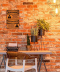 Warning Moving Equipment Metal Sign 8x12 Inch Aluminum Wall Decor on brick wall above desk with plants and vintage typewriter.