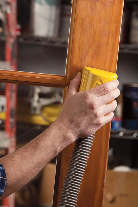 Lightweight Dust Free Sponge Sander Kit With Vacuum Hose And Two Sponges used on wooden door frame