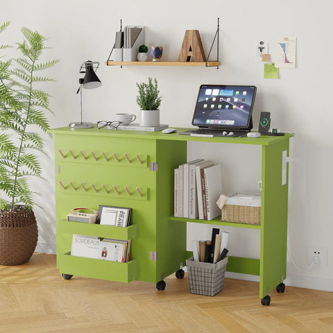 Slick Fold Up Sewing Table With Built In Charging Port And Smooth Rolling Lockable Wheels Nifty Storage Trays Pegs And Deep Bin in vibrant green color.