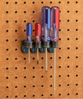 16 Piece Pliers And Drivers Pegboard Hook Set With Heavy Duty Hooks And Screwdriver Rings holding four screwdrivers on hardboard pegboard.