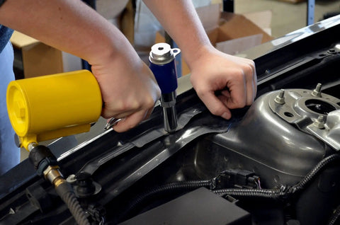 Using Powerful Air Riveter With Five Nosepieces For Hard To Reach Areas on auto body panel for precise metalworking