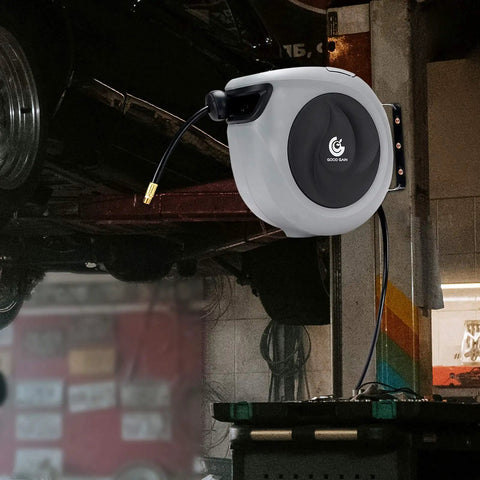 Retractable Air Hose Reel With Three Eighths Inch By 50 Ft Hybrid Polymer Hose Auto Rewind Enclosed Shop Ready Mount Heavy Duty 180 Degree Swivel 300 PSI Pro Grade Commercial Quality Polypropylene Gray mounted on a garage wall