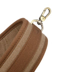 Close-up of Canvas Bird Game Carrier For Waterfowl And Small Animals with brass snap hook and cowhide leather trim, brown