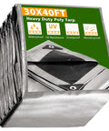 Stacked Heavy Duty 30x40 Ft Tarp Waterproof 10 Mil Tarpaulin With Eyelets, showcasing gray material with UV protection icons.