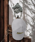 Handcrafted Cast Iron Horsehead Wall Hook With A Knockout Rustic Coffee Bean Brown Finish built like a tank, supporting a white cap.