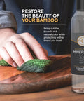 Hand applying Food Grade Mineral Oil For Wood Cutting Boards And Utensils, 16 Oz Butcher Block Oil Conditioner on wooden board