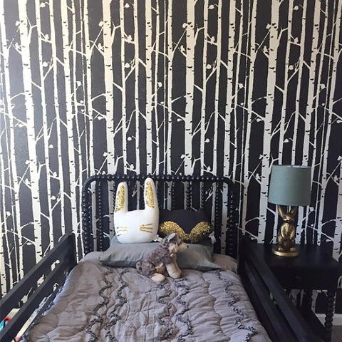Birch Forest Wall Stencil XL 24x37 In For Large Pattern Painting behind bed with plush toys in modern boho bedroom decor.