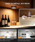 Rechargeable Wireless Puck Lights With Remote Control, Sweet Smooth Glow Under Cabinet Lighting, 3 Color Dimmable Peel And Stick Pad For Kitchen Counter Closet Shelf 2 Pack installation guide with wine bottles and glasses.