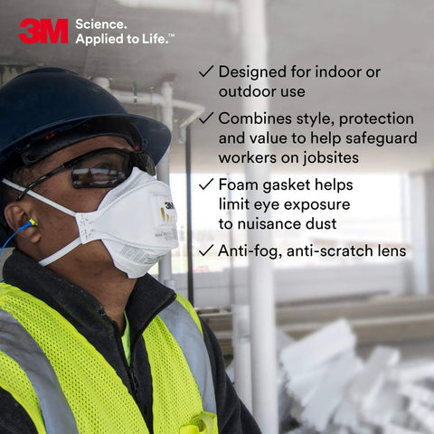 Person wearing Virtua CCS Safety Glasses with Anti Fog Lens, gray lens, black frame, foam gasket, and ear plugs on a worksite.