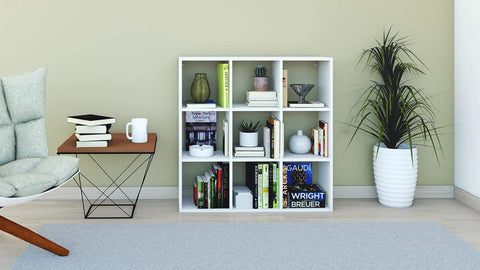 DIY Cube Organizer Shelf With Nine Cubes For Bedroom Living Room And Home Office In White Made In USA Easy To Assemble Sturdy Modular Storage For Books Decor And Plants, placed in a styled living room with decor items and plants.