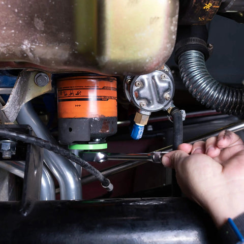 Adjustable Oil Filter Wrench For Three And One Eighth To Three And Seven Eighth Inch Filters in use on small truck engine