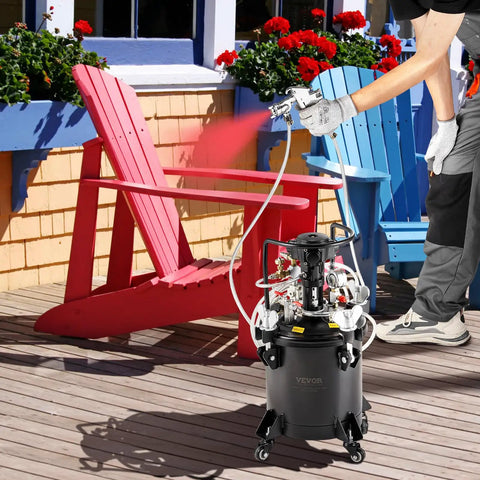 No Sweat Automatic Stirring Spray Paint Pressure Pot Two Point Five Gallon Air Powered Paint Mixer Tank with sprayer in use on patio.