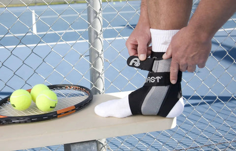 A60 Ankle Support Brace For Right Foot White Medium With Side Stabilizers Molded At Sixty Degree For Mild Support on foot with tennis gear