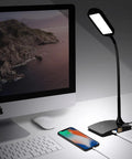 Ivy LED Desk Lamp With USB Port And 3 Way Touch Switch, Ultra Efficient Black Reading Light beside a desktop computer.