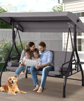 Family sitting on Three Seat Patio Swing With Adjustable Canopy And Stand Heavy Duty Outdoor Porch Glider Bench in backyard