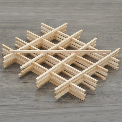 25 Pack Square Wood Dowel Rods 5/16 X 15 Inch Unfinished Pine Craft Sticks arranged in a grid on a wooden surface.