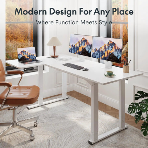 Sweeping L Shaped Standing Desk With Sturdy Four Leg Frame For Epic Gaming Or Pro Workstations, seen with monitors in modern office.