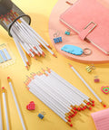 50 Pack Triangular Grip Wood Pencils With Erasers White HB Graphite Pencils For Writing Drawing And Sketching on a desk