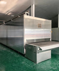 High Capacity Industrial IQF Tunnel Freezer Built Different Stainless Steel Conveyor Belt Blast Freezing System For Quick Freezing Meat Seafood Produce Factory Plant Operations with stainless exterior and conveyor belt.