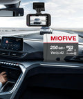 Heavy Duty Industrial Micro SD Card Built Tough For Dash Cams And Security Recorders With Extreme Endurance To Crank Out Relentless Loop Recording Without Drama Up To 256GB inside a car cockpit near a dash cam.