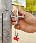 Heavy-Duty Long Reach Control Cabinet Keys For Gas Water And Electrical Shutoffs 3 Inch Tool in use on metal panel