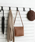 25 Pack Slatwall Hooks Hangers Heavy Duty J Shaped Slatwall Panel Hooks with umbrella, sweater, bag, hat displayed