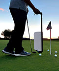 Golfer using a Golf Ball Shag Portable Ball Picker, Compact Practice Essential, 24-Ball Capacity, Grab-and-Go Retriever at sunset