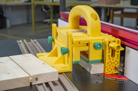Kickback Buster 3D Push Block With Gravity Heel Kit For Table Saws, large yellow push block positioned on wood.