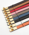 White Skinny Leather Belt For Women With Adjustable Golden Turn Lock Buckle Hole Free Thin Waist Strap Totally Clutch Accessory For Slaying Jeans Daily, displayed among various colored belts.