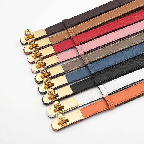 White Skinny Leather Belt For Women With Adjustable Golden Turn Lock Buckle Hole Free Thin Waist Strap Totally Clutch Accessory For Slaying Jeans Daily, displayed among various colored belts.