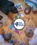 Group assembling Hot Air Balloon Festival 1000 Piece Jigsaw Puzzle With Easy Grip Pieces For Big Fun Building Sessions And A Sweet Way