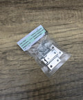1.96 Inch Stainless Steel Folding Cabinet Hinges Kit, 4 Pack With 16 Screws, Rust Resistant, packaged on wooden surface