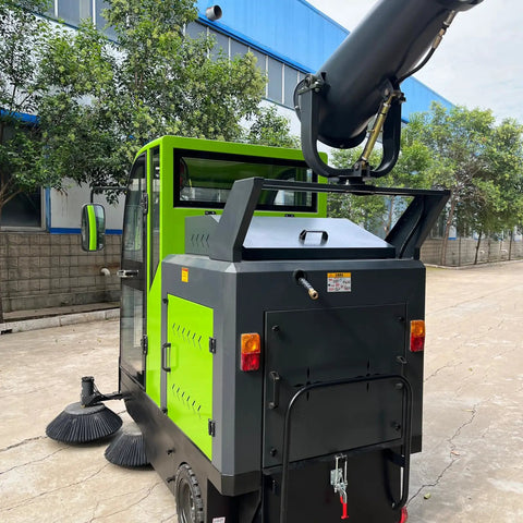 Heavy Duty Commercial Ride On Floor Sweeper For Industrial Warehouses. Powerful Motorized Cleaning Machine With Spacious Debris Hopper. Essential Equipment For Maintaining Sparkling, Dust-Free Concrete Floors At Factories And Large Facilities. Built To