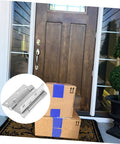 Residential door spring hinge set for double-opening doors, stainless steel hardware on a wooden front door.