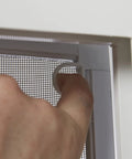 Vinyl Basement Slider Window 32 By 22 Inch White With Easy Glide Sash And Heavy Duty Frame close-up of handle operation.