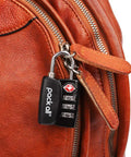 4 Pack TSA Approved Luggage Locks With 3 Digit Combination on leather bag zipper, black alloy, red indicator visible.