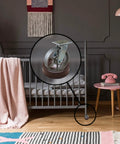 Small Furniture Wheel Caster Cups With Non Skid Rubber Grip Set Of 4 Floor Protectors installed under crib leg on wooden floor