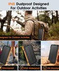 Man hiking with massive 49800mAh wireless power bank with built-in cables, IP65 design, attached to backpack.