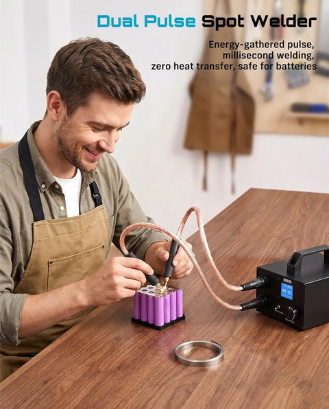 Man using Beast 10KW Capacitive Battery Spot Welder for DIY battery packs and repair with 12 volt power supply on wooden table