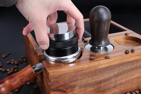 User adjusting the Top Shelf 58mm Espresso Distributor And Tamper Set, Dual Head Coffee Leveler for perfect brewing.