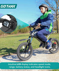 Young rider on an Off Road Electric Dirt Bike With 16 Inch Pneumatic Tires 300W Brushless Motor 15.5 MPH Top Speed 16 Mile Range Dual Suspension And Disc Brake Trail Ready Ride For 47 To 67 Inches Black, with focus on LCD display.