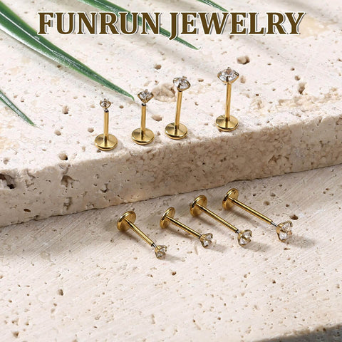 Gold Zircon Nose Studs 20 Piece Set Dope Threadless Flat Back Nose Jewelry 18G 20G shown on stone surface.