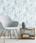 Room with chair and table against Marble Seas Metallic Blue Peel And Stick Wallpaper Roll Removable And Repositionable No Mess