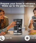 Two women using CafeCraft 12 Cup Programmable Coffee Maker With Stainless Steel Drip Design, breakfast setup